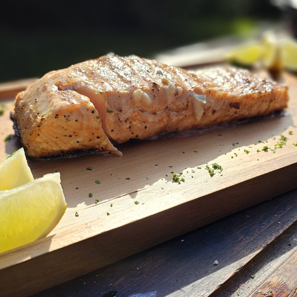 Grilled Salmon fillets infused with fresh ginger, cooked over live embers.