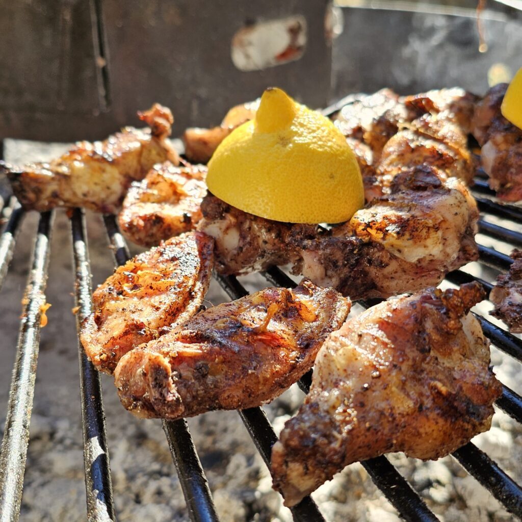 Hardwood-grilled chicken wings, a casual yet elevated catering option for game night.